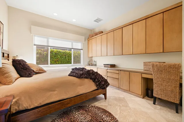 a view of a patio with couches table and chairs with potted plants