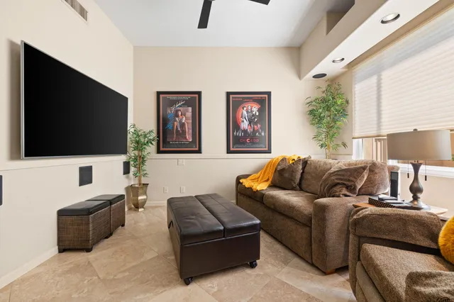 a view of a patio with a table and chairs