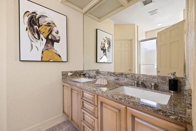 a view of a patio with a table and chairs