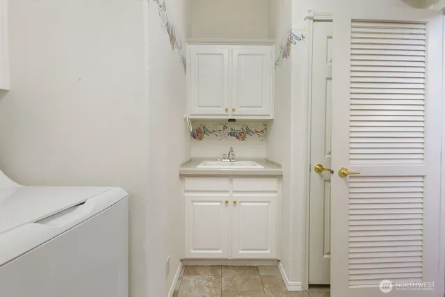 an aerial view of a house with lake view and a big yard