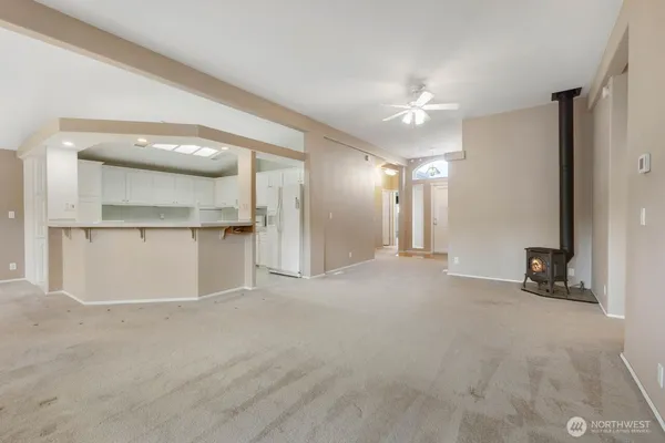 a view of an empty room with a window