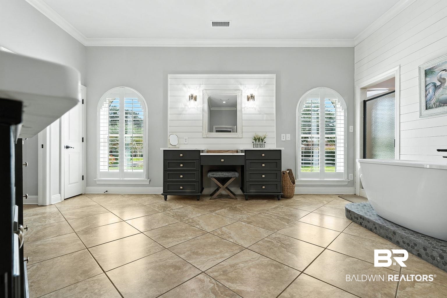 23357 Carnoustie Drive Foley, AL 36535 - Photo 50 of 99 Full bath with crown molding, vanity, plenty of natural light, a freestanding bath, and tile patterned floors