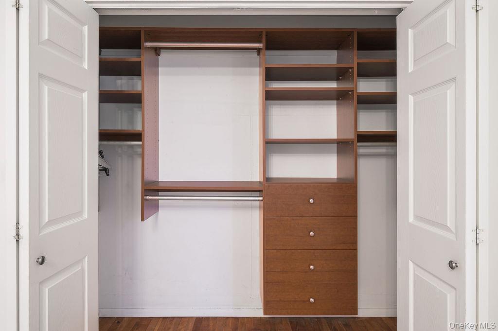 103 Wiltshire Road, Unit D6 Scarsdale, NY 10583 - Photo 15 of 20 a view of walk in closet with empty racks