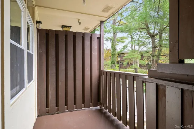 a view of a house with backyard and porch
