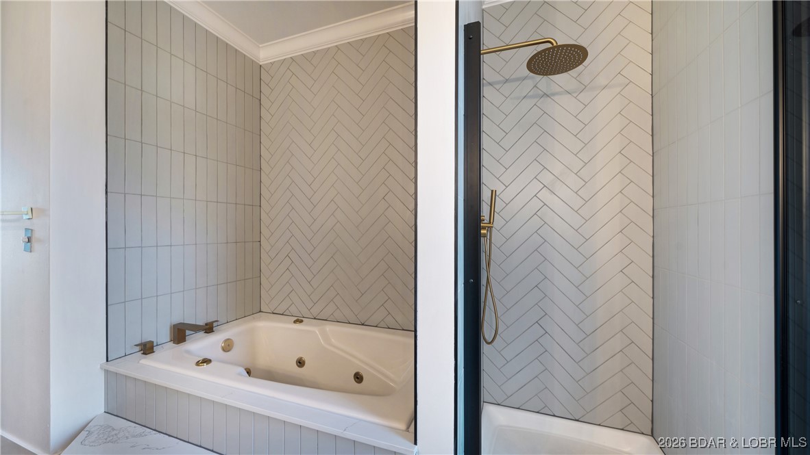 2268 Breezy Acres Road Osage Beach, MO 65065 - Photo 27 of 49 Tile walk-in shower and jetted tub w/ crown moldin