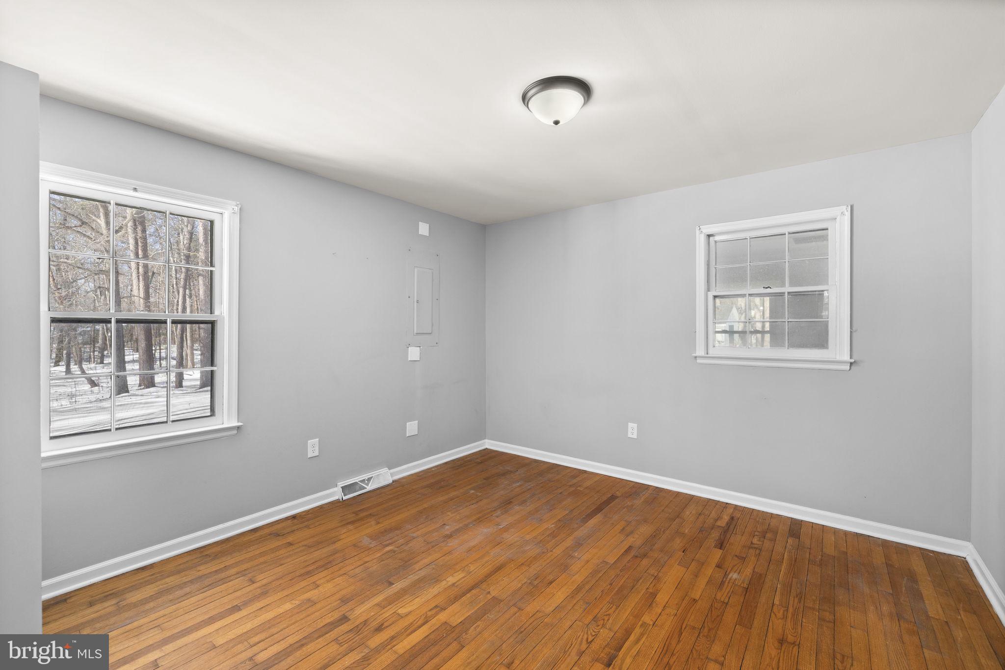 727 Chalklevel Road Louisa, VA 23093 - Photo 12 of 49 a view of empty room with wooden floor and fan