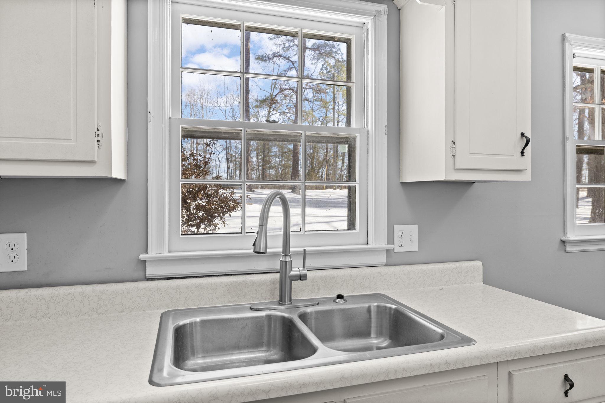 727 Chalklevel Road Louisa, VA 23093 - Photo 19 of 49 a close view of a sink and dishwasher with wooden floor
