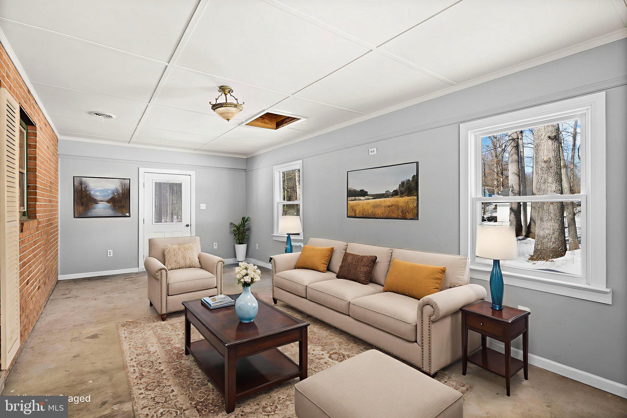 727 Chalklevel Road Louisa, VA 23093 - Photo 22 of 49 a living room with furniture a flat screen tv and a window