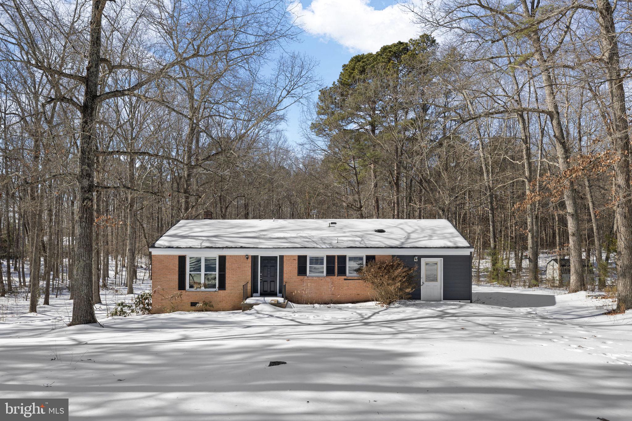 727 Chalklevel Road Louisa, VA 23093 - Photo 43 of 49 a front view of a house with a garden and trees