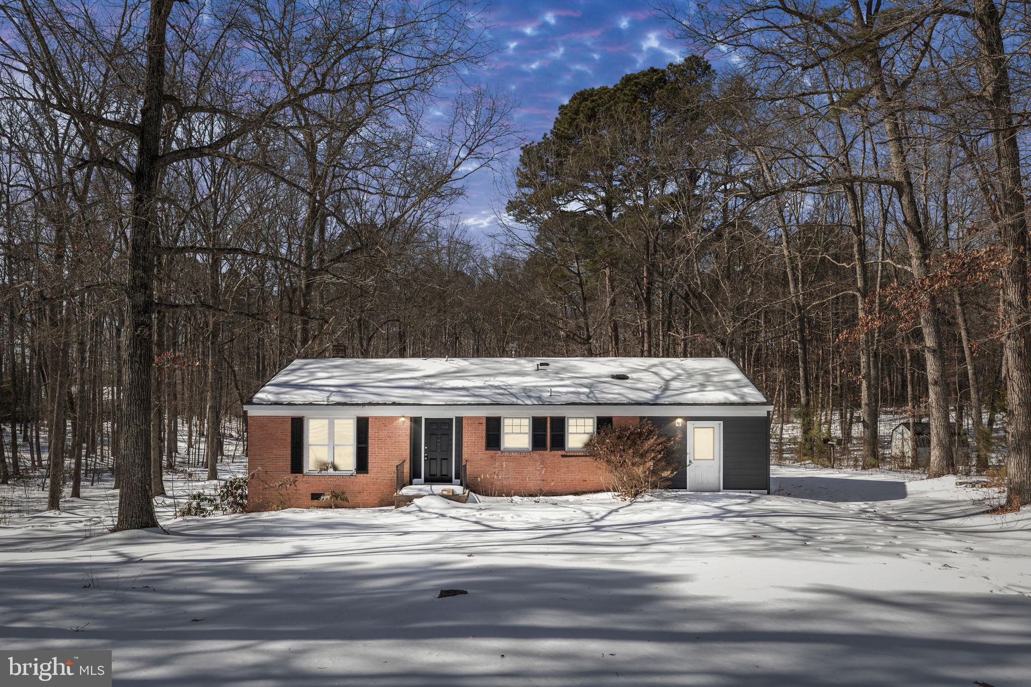 727 Chalklevel Road Louisa, VA 23093 - Photo 49 of 49 a view of a big house in a big yard with large trees