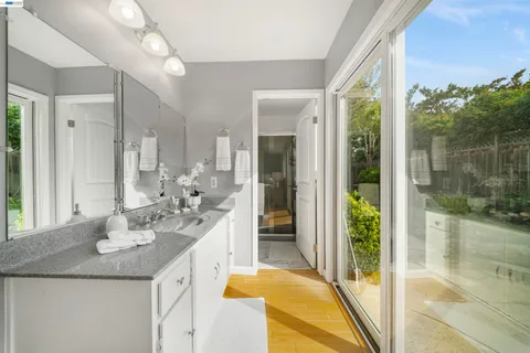 a living room with furniture and view of kitchen