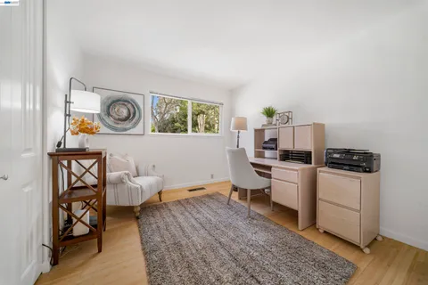 a view of a house with backyard porch and sitting area