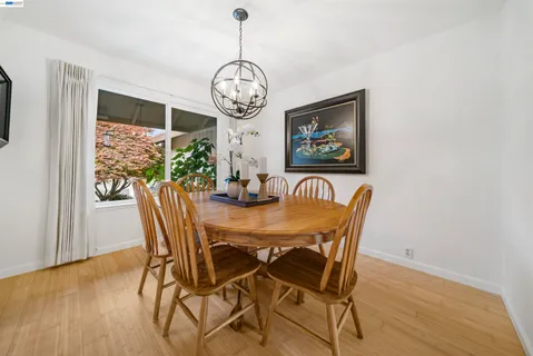 a kitchen with stainless steel appliances granite countertop wooden cabinets stove and a sink