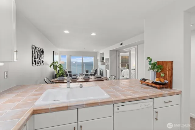 a view of kitchen with sink and living room