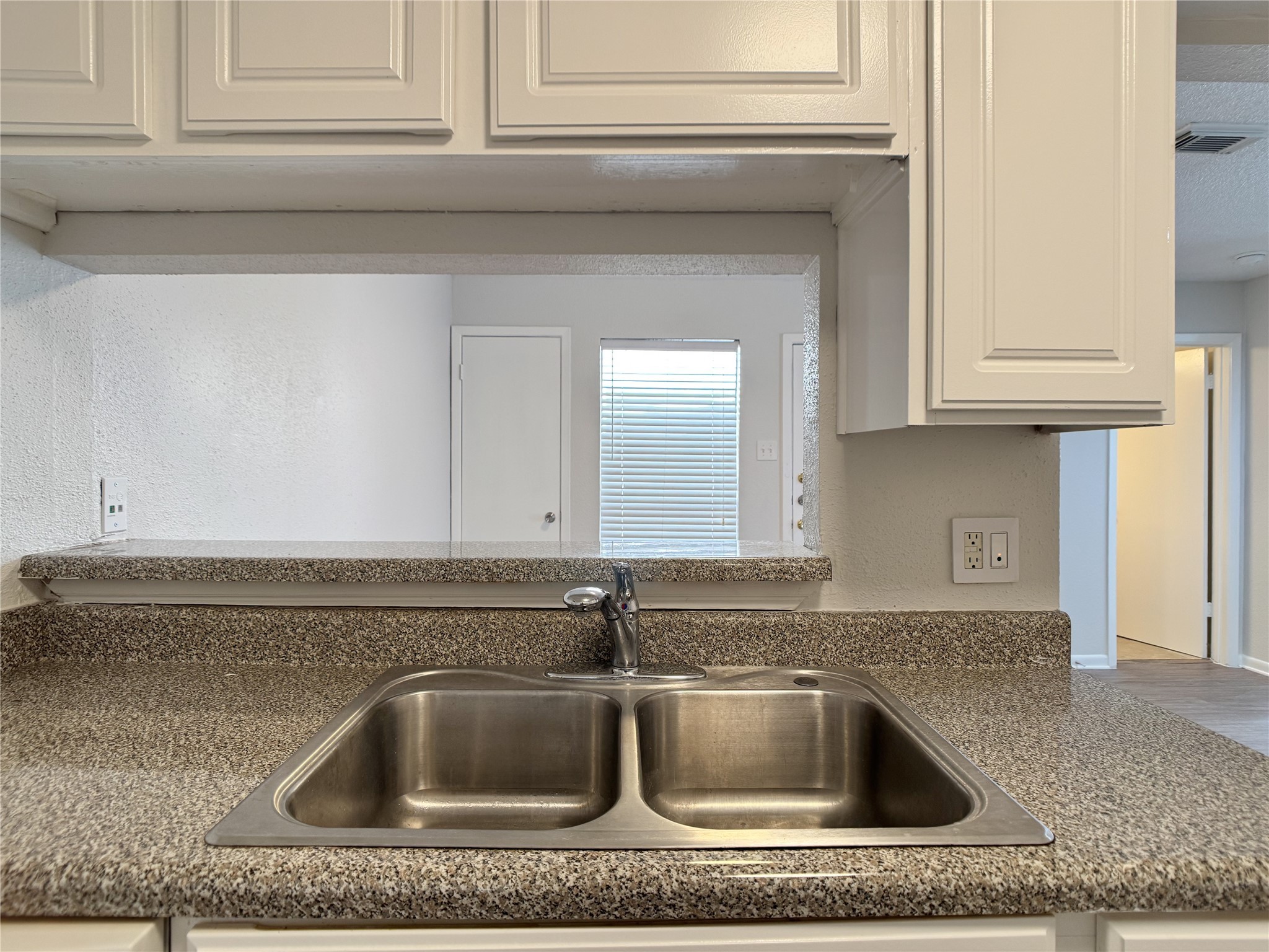 2277 South Kirkwood Road, Unit 404 Houston, TX 77077 - Photo 13 of 39 a close view of a sink and kitchen