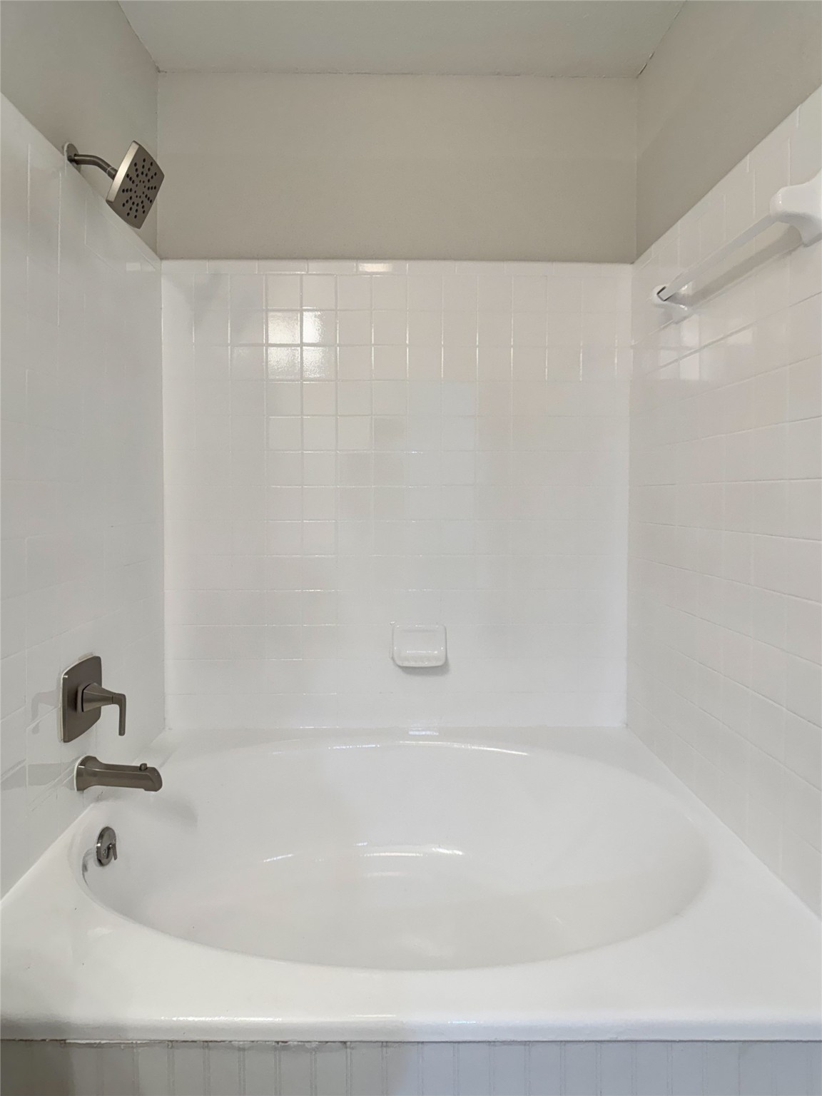 2277 South Kirkwood Road, Unit 404 Houston, TX 77077 - Photo 24 of 39 a bathroom with a bathtub and shower