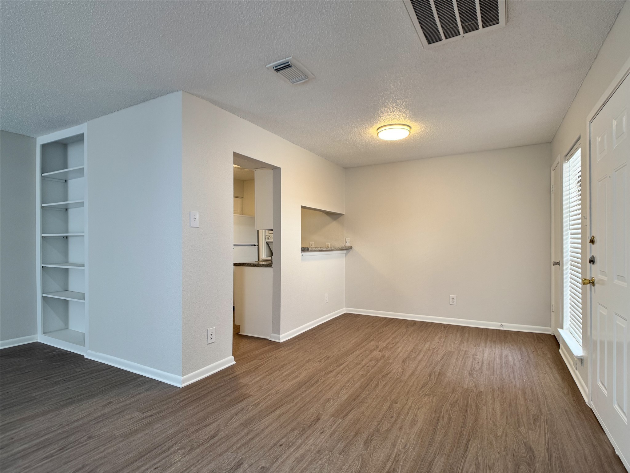 2277 South Kirkwood Road, Unit 404 Houston, TX 77077 - Photo 29 of 39 wooden floor in an empty room with a window