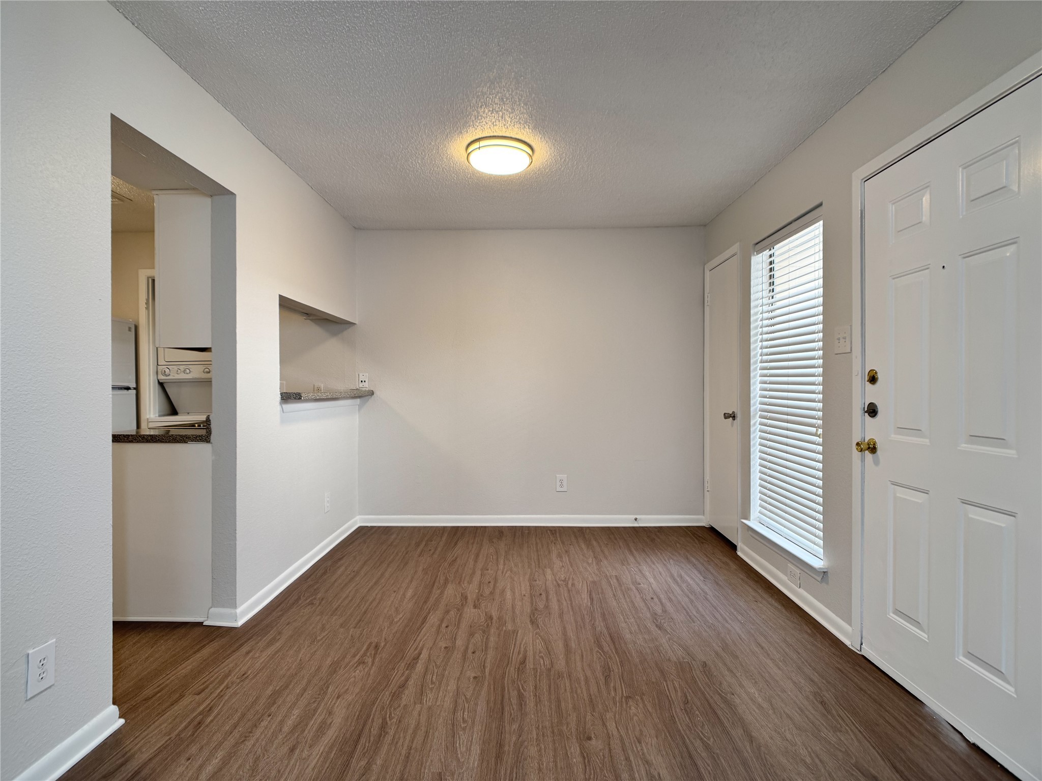 2277 South Kirkwood Road, Unit 404 Houston, TX 77077 - Photo 9 of 39 wooden floor in an empty room with a window