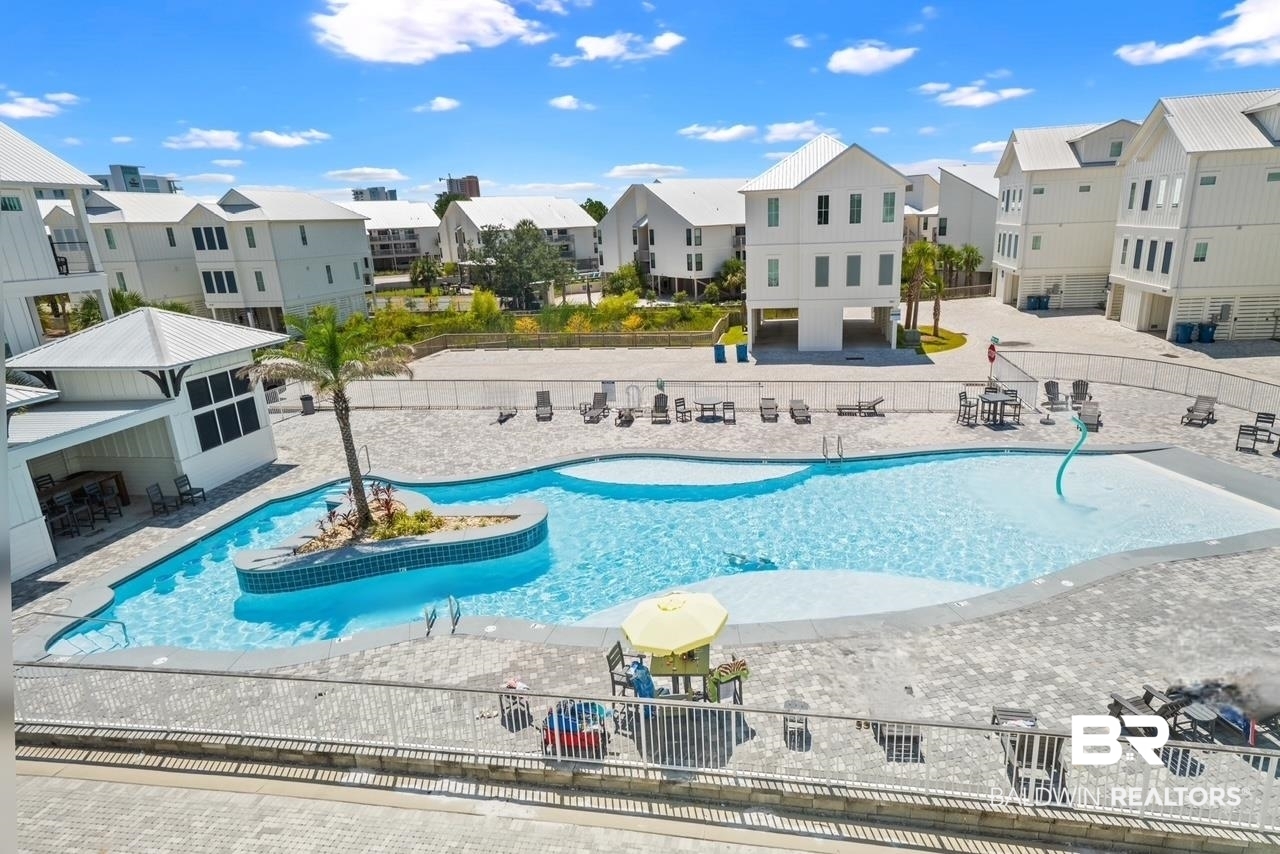 3188 Egret Run Orange Beach, AL 36561 - Photo 34 of 37 Community pool featuring a residential view and a patio