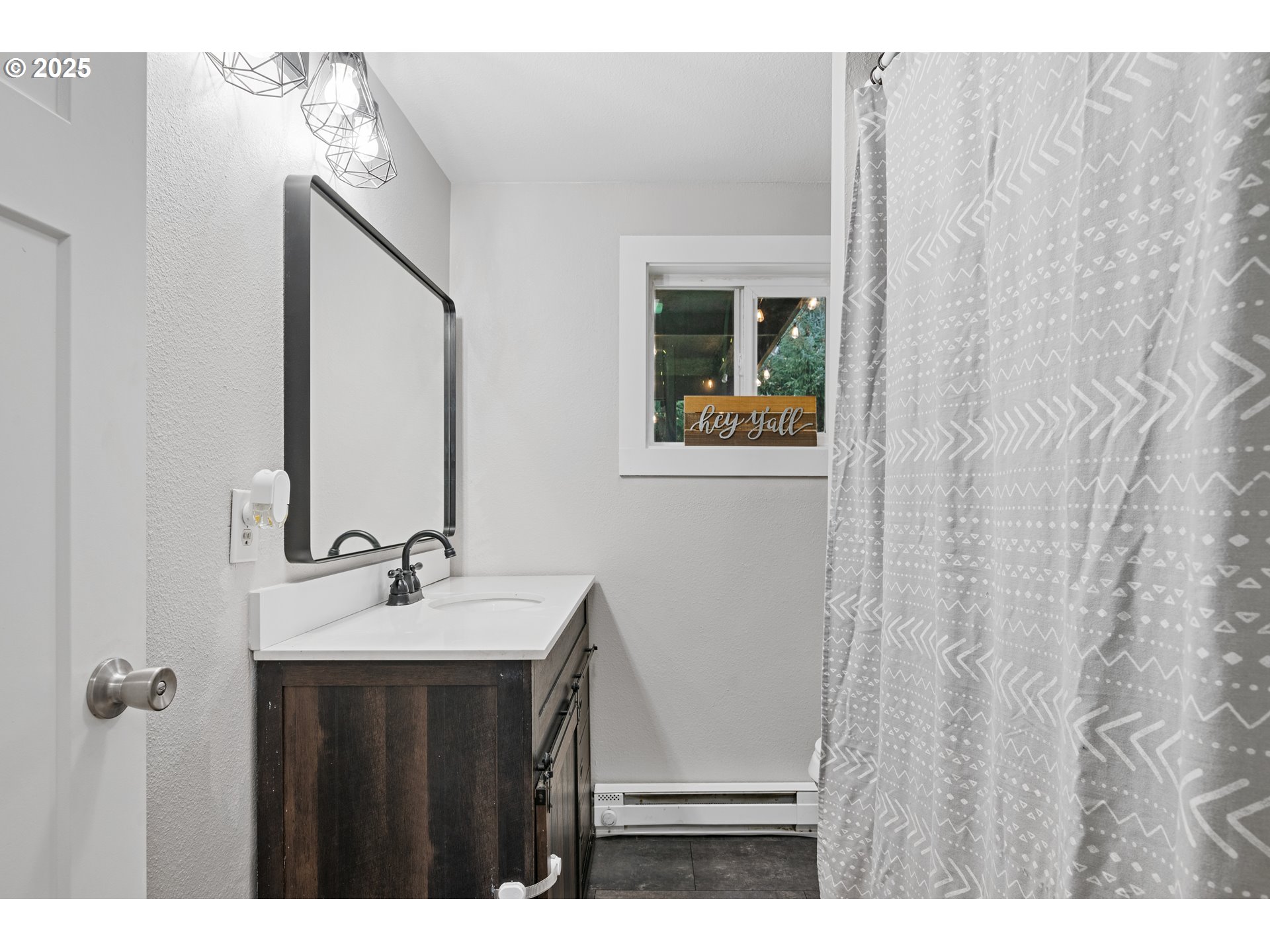 3317 Olive Way Longview, WA 98632 - Photo 14 of 29 a bathroom with a sink and a mirror