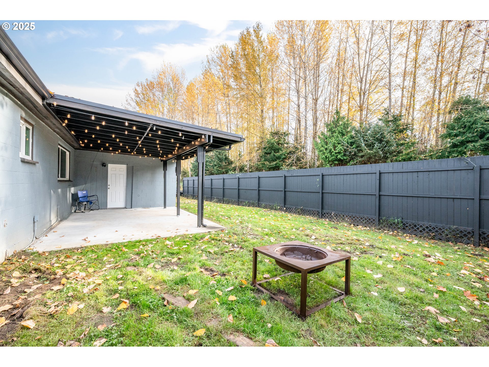 3317 Olive Way Longview, WA 98632 - Photo 23 of 29 a backyard of a house with table and chairs