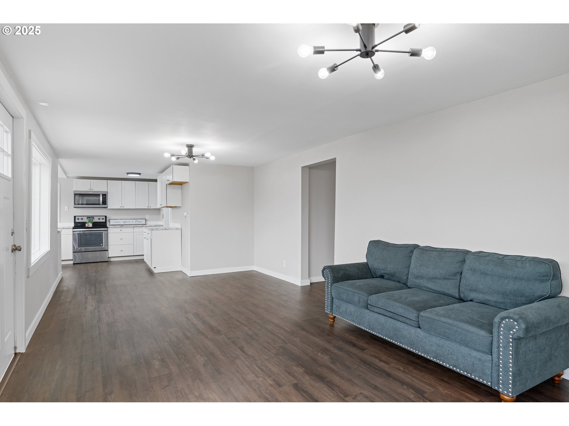 3317 Olive Way Longview, WA 98632 - Photo 6 of 29 a living room with furniture and kitchen view