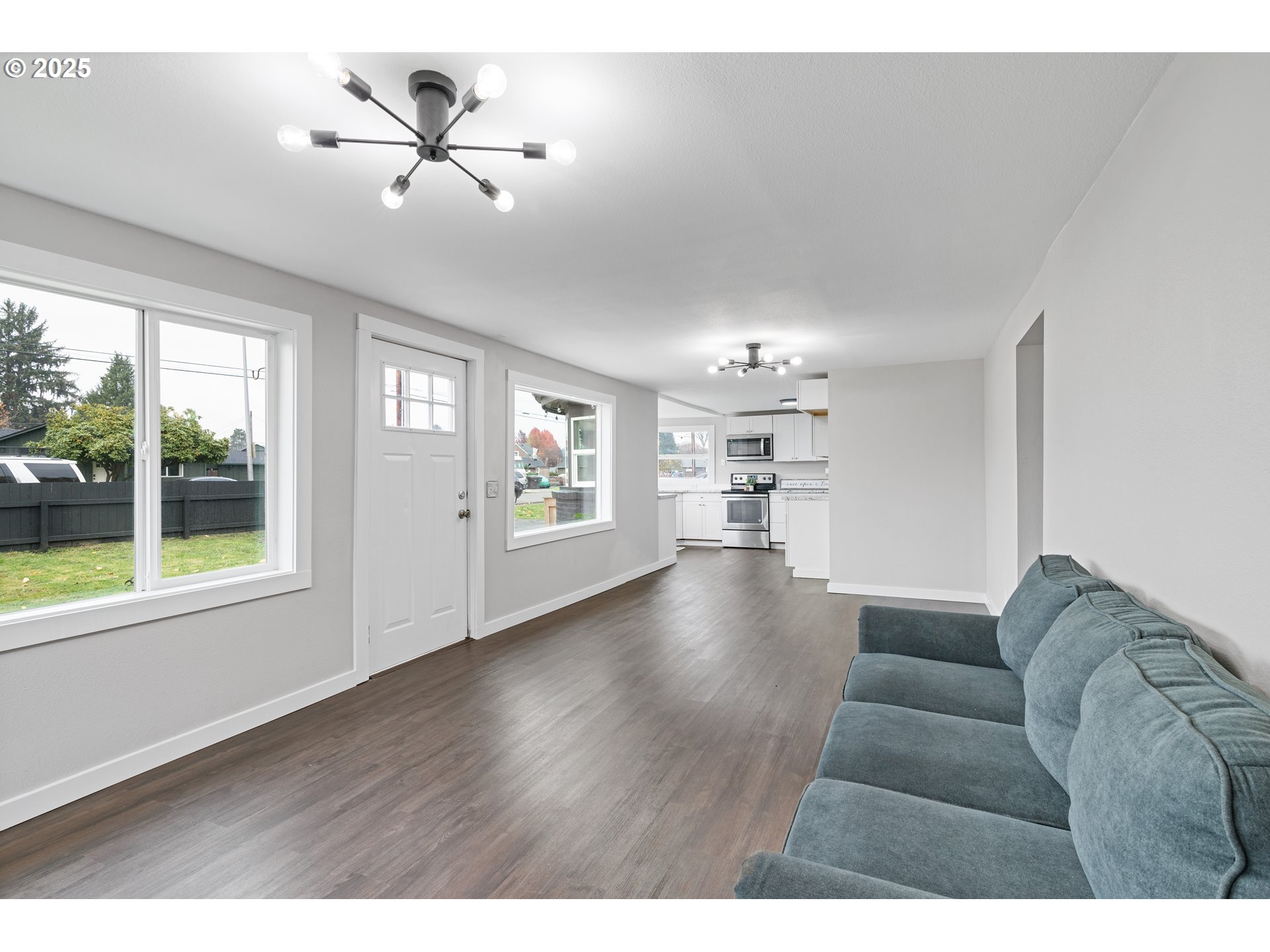 3317 Olive Way Longview, WA 98632 - Photo 7 of 29 a living room with furniture and a chandelier
