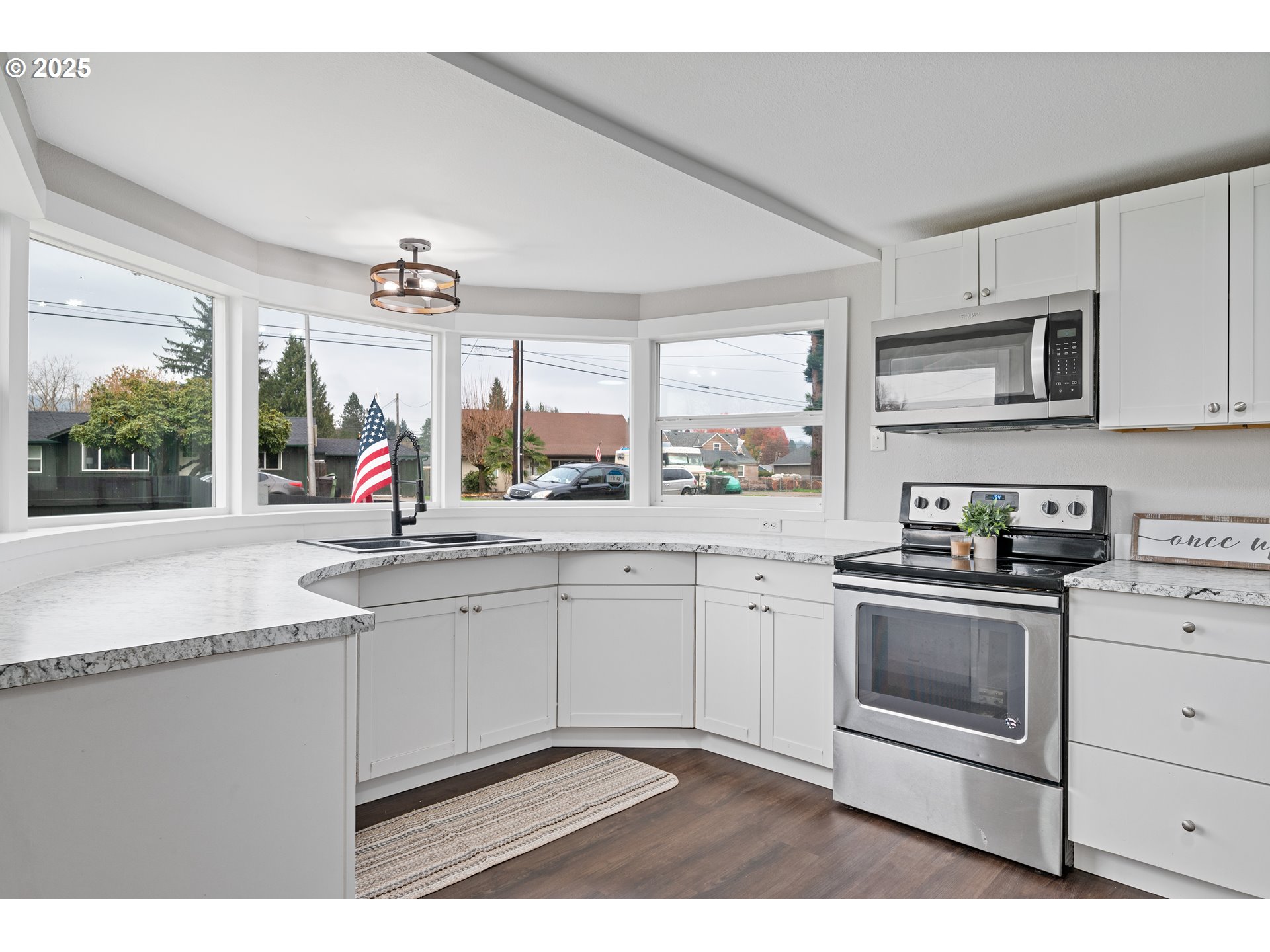 3317 Olive Way Longview, WA 98632 - Photo 8 of 29 a kitchen with stainless steel appliances granite countertop a sink a stove and cabinets