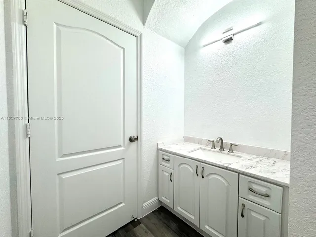 a white toilet sitting next to a bath tub and a shower