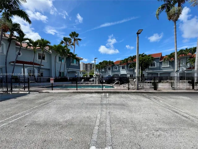 a view of a car park in front of a building
