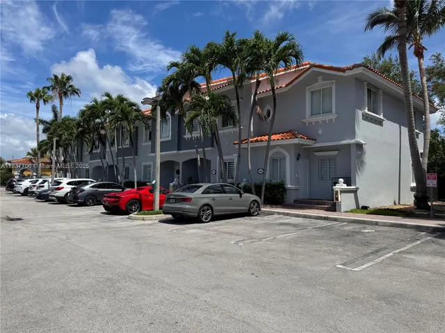 a view of a park with large trees
