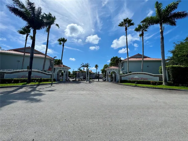 a view of a street with a building in the background