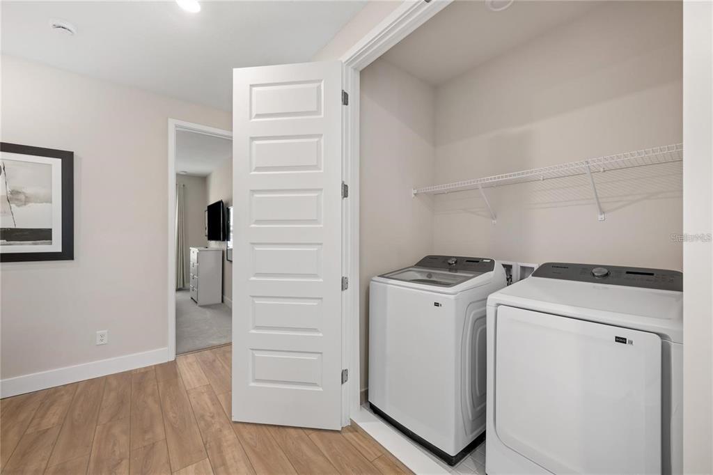 7834 Spectrum Drive Reunion, FL 34747 - Photo 14 of 16 a view of storage and utility room with washer and dryer