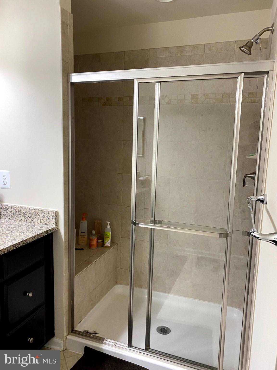 Sleek modern shower with elegant tiles.