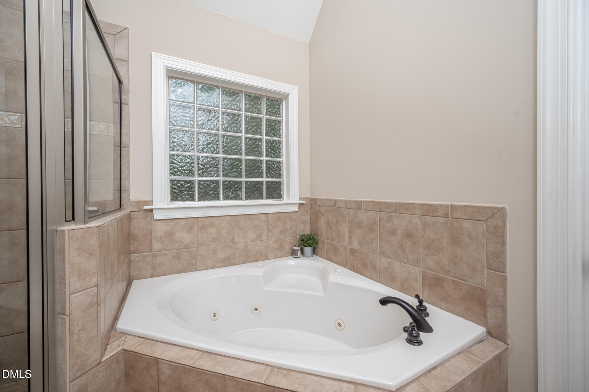 726 Ruth Circle Fuquay-Varina, NC 27526 - Photo 29 of 61 a bathroom with a white bath tub and a window