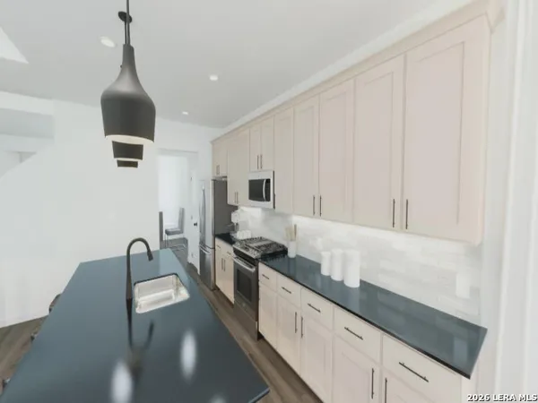 a picture of a bathroom with a sink and a mirror