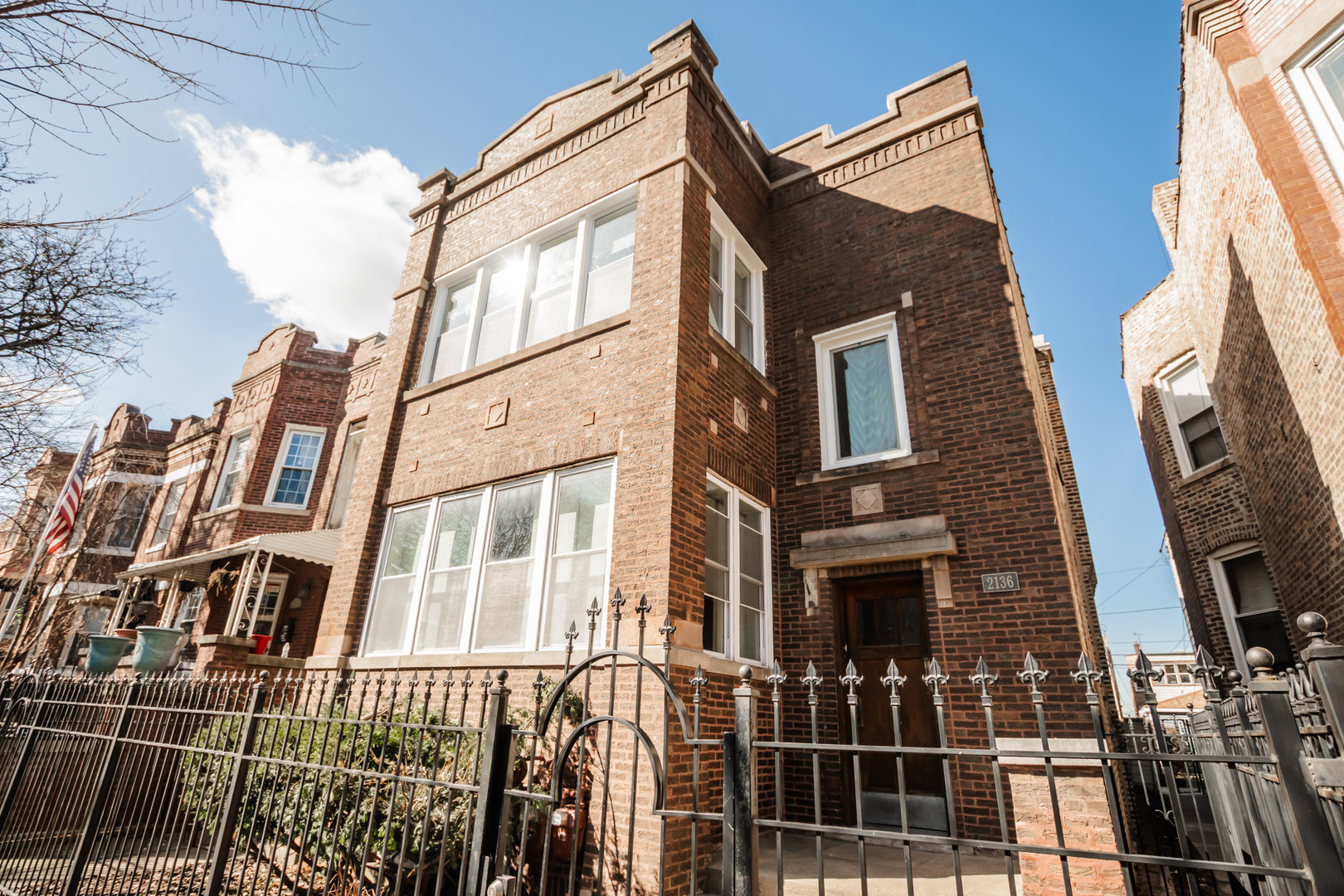 2136 North Avers Avenue, Unit 2 Chicago, IL 60647 - Photo 1 of 21 a view of a brick house with many windows