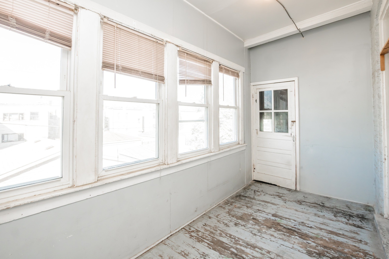2136 North Avers Avenue, Unit 2 Chicago, IL 60647 - Photo 19 of 21 a view of empty room with wooden floor and fan