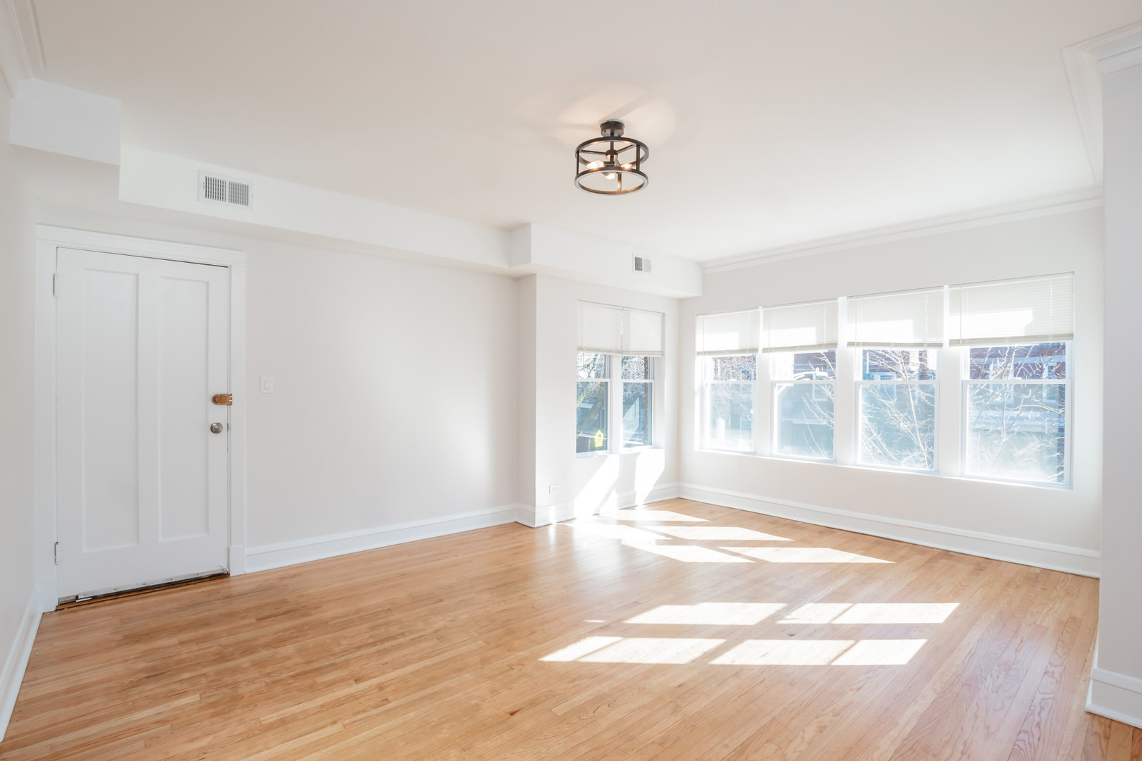 2136 North Avers Avenue, Unit 2 Chicago, IL 60647 - Photo 4 of 21 a view of an empty room with a window