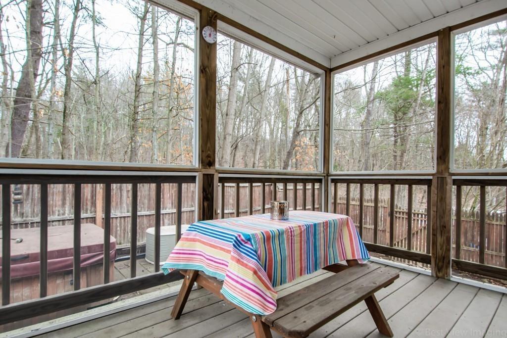 275 Reservoir Road Lunenburg, MA 01462 - Photo 8 of 31 a bedroom with a bed and wooden floor