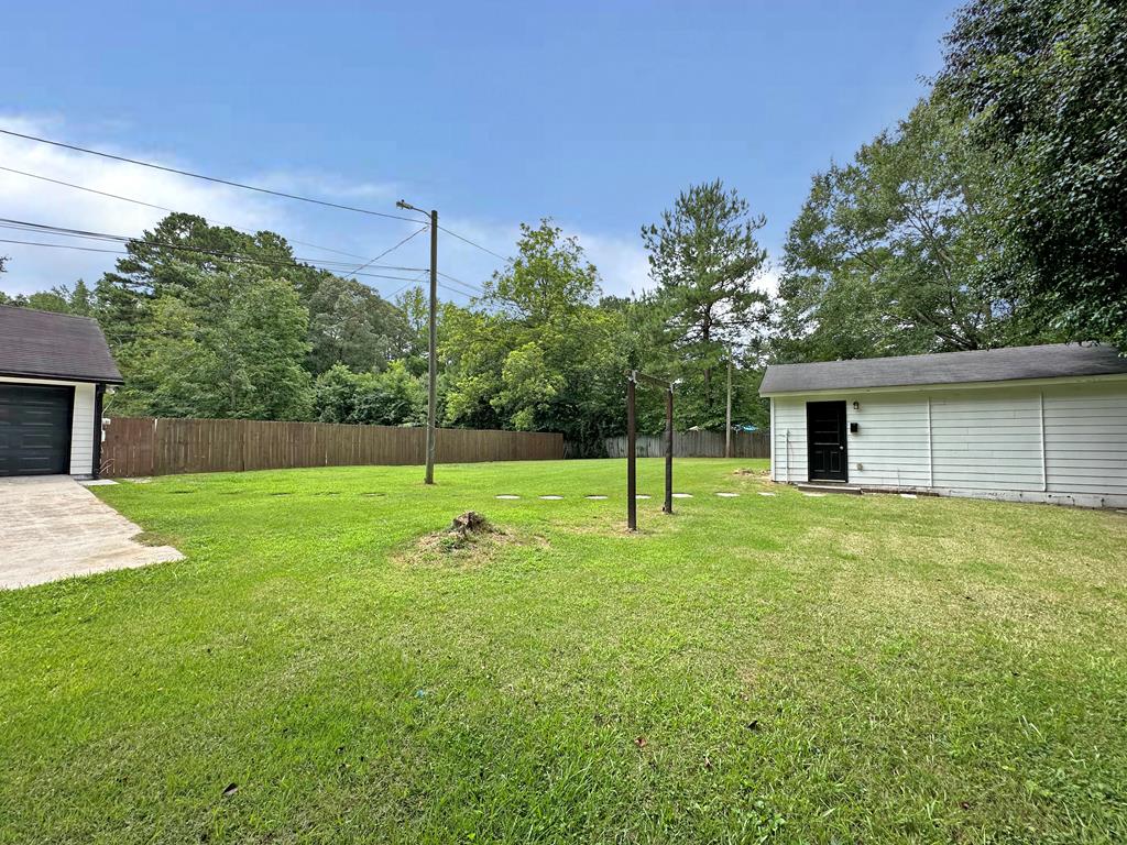 558 Macedonia Road Newnan, GA 30263 - Photo 2 of 44 a house view with a play ground in front of it