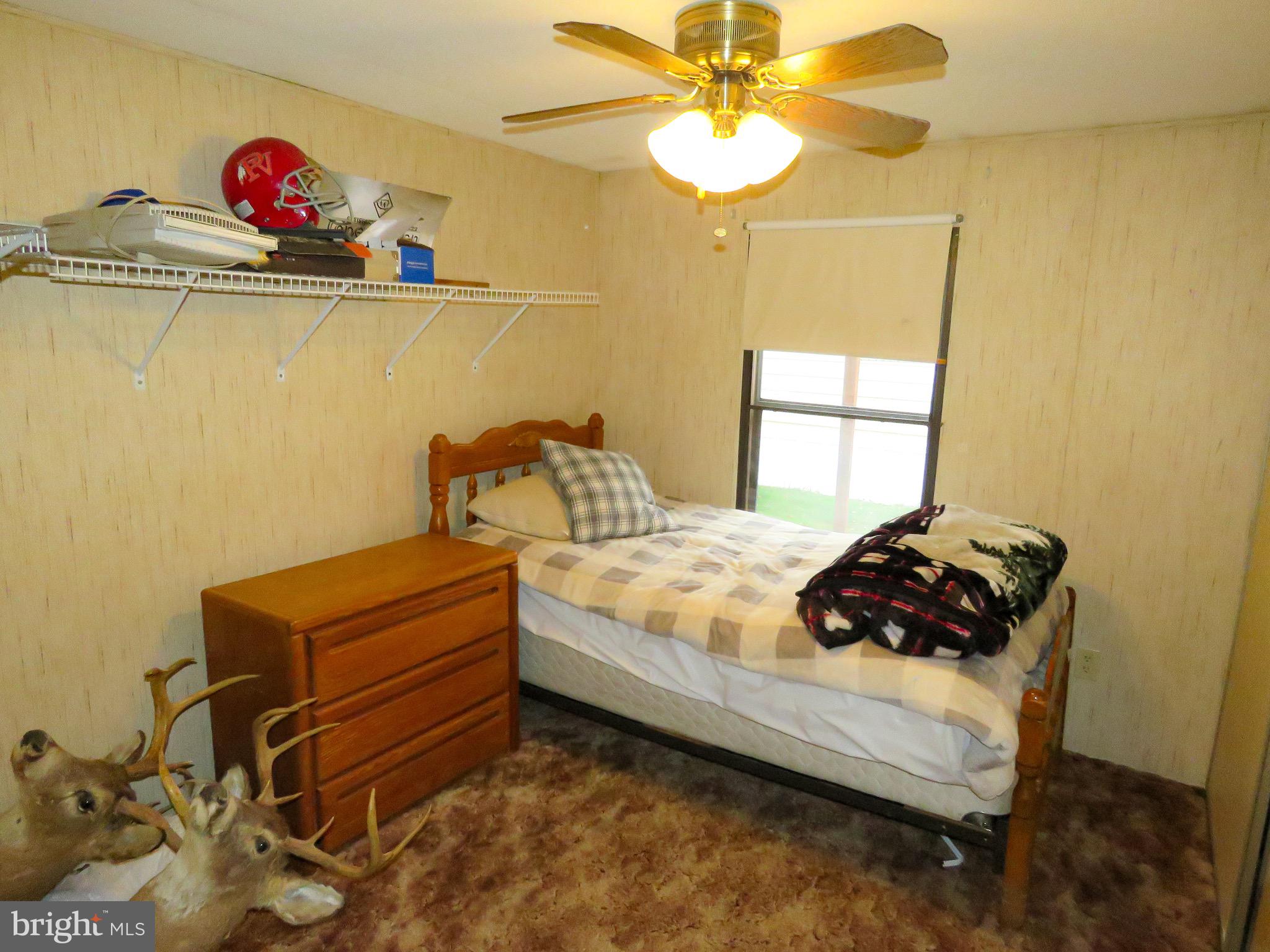 2379 River Road Bainbridge, PA 17502 - Photo 11 of 15 a bedroom with a bed and a chandelier