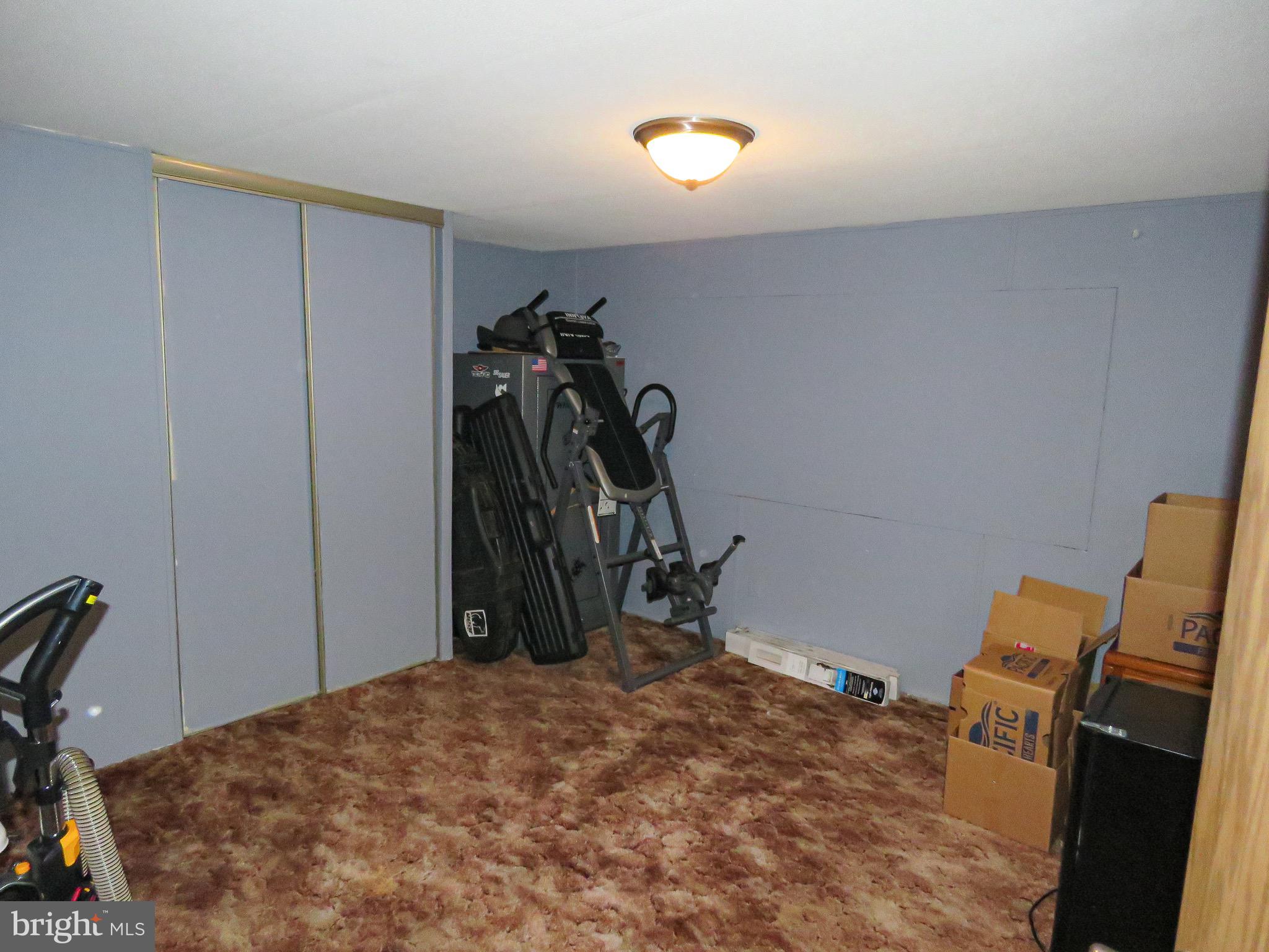 2379 River Road Bainbridge, PA 17502 - Photo 12 of 15 a bed room with a bed and a closet