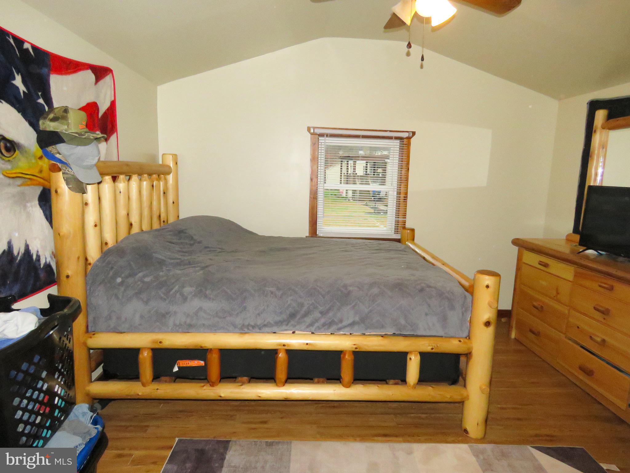 2379 River Road Bainbridge, PA 17502 - Photo 7 of 15 a bedroom with a bed and a flat screen tv