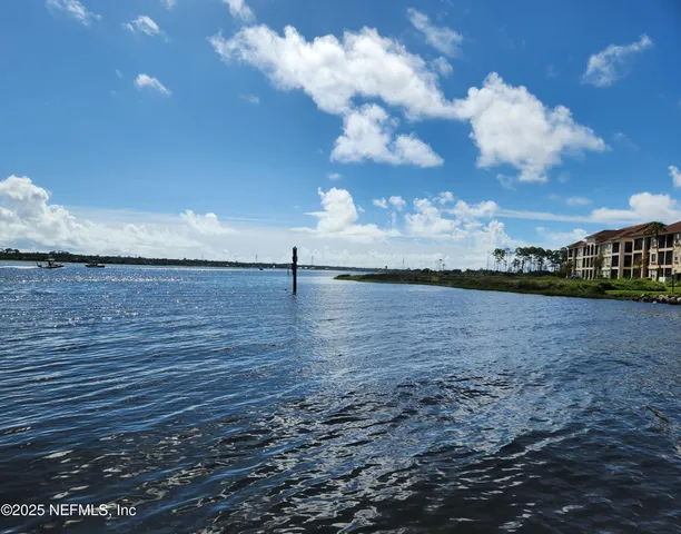 a view of swimming pool with outdoor seating and city view