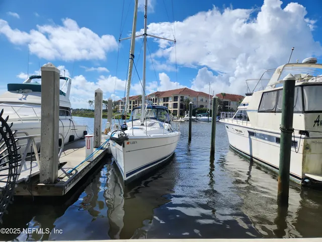 a view of swimming pool with outdoor seating and city view