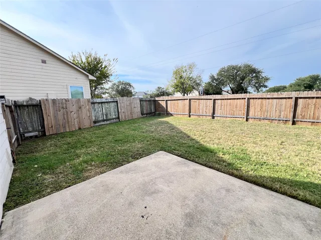 a view of a backyard with a small cabin