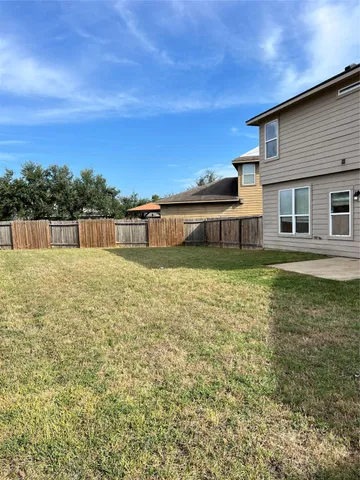 a swimming pool with lawn chairs