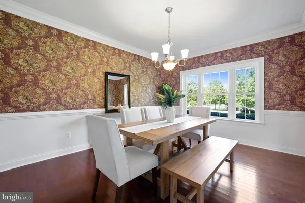 a view of kitchen island with furniture and wooden floor