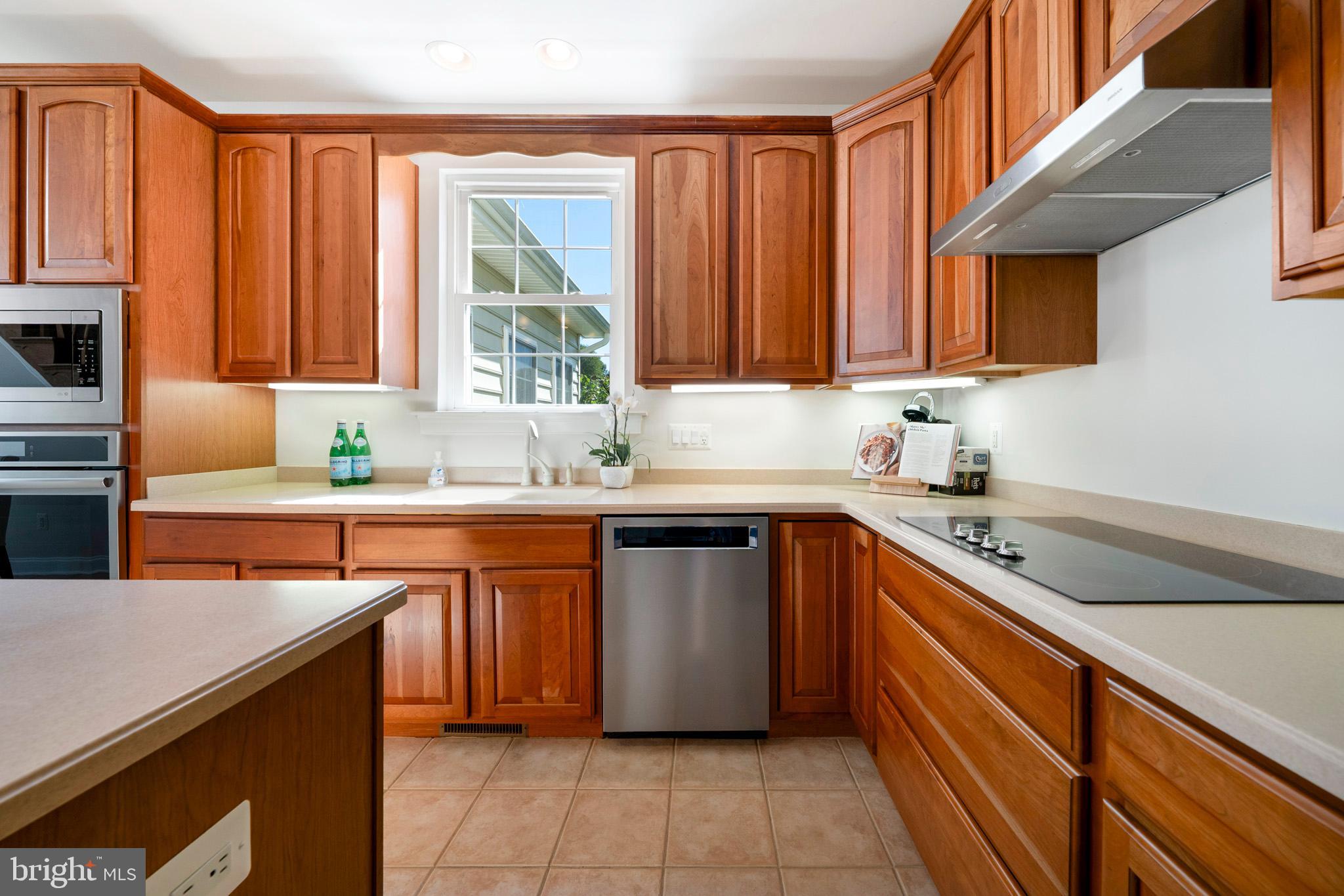 3300 Lancer Court Dunkirk, MD 20754 - Photo 16 of 89 a kitchen with stainless steel appliances granite countertop a sink stove and cabinets